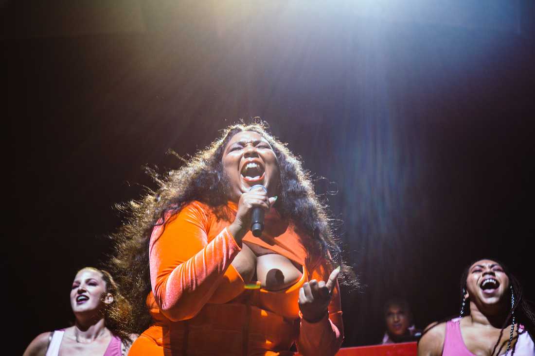 Lizzo sings out to the Moda Center crowd. The hip-hop singer later mentioned her excitement toward the show being the second installment of her first-ever arena tour. Lizzo opens for Florence + the Machine at the Moda Center in Portland, Ore. on Sept. 11, 2018. (Sarah Northrop/Emerald)