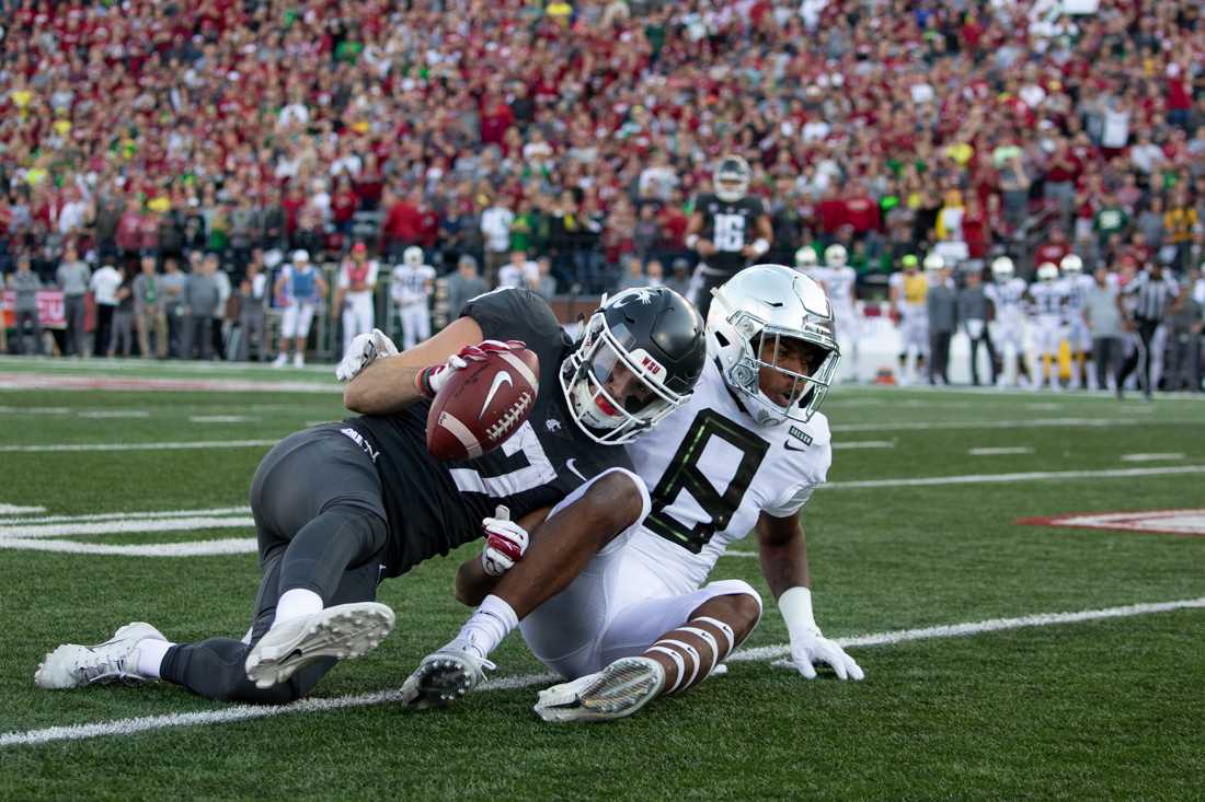 Ducks safety Jevon Holland (8) brings down a Cougar. Oregon Ducks Football takes on Washington State University at Martin Stadium in Pullman, Wash. on Oct. 20, 2018. (Sarah Northrop/Emerald)