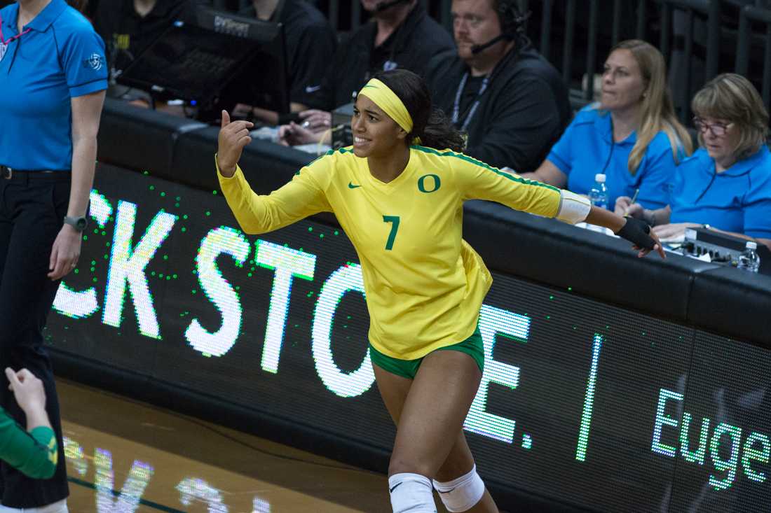 Ducks middle blocker Ronika Stone (7) celebrates after a point. Oregon Ducks Volleyball hosts Stanford at Matthew Knight Arena on Oct. 21, 2018. (Ben Green/Emerald)