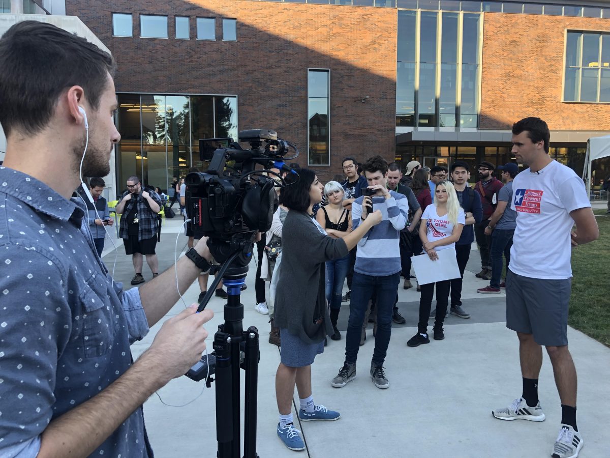 Charlie Kirk, founder of conservative group Turning Point USA, talks to students outside of the EMU on Oct. 17, 2018. (Frankie Benitez/Emerald)