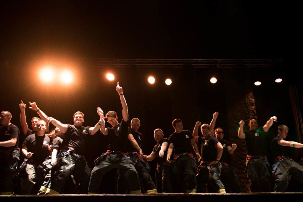 The Eugene and Springfield Fire Department light up the stage with their routine. Teams from Eugene and Springfield participate in the Relief Nursery&#8217;s Lip Sync Battle Reloaded at the McDonald Theater in Eugene, Ore. on Oct. 26, 2018. (Madi Mather/Emerald)