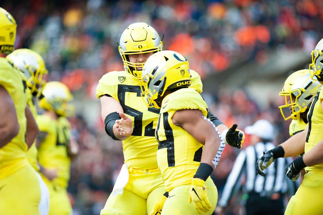 Ducks offensive lineman Jake Hanson (55) and running back CJ Verdell (34) celebrate after the touchdown.&#160;Oregon Ducks football takes on the Oregon State University Beavers for the Civil War at Reser Stadium in Corvallis, Ore. on Nov. 23, 2018. (Sarah Northrop/Emerald)