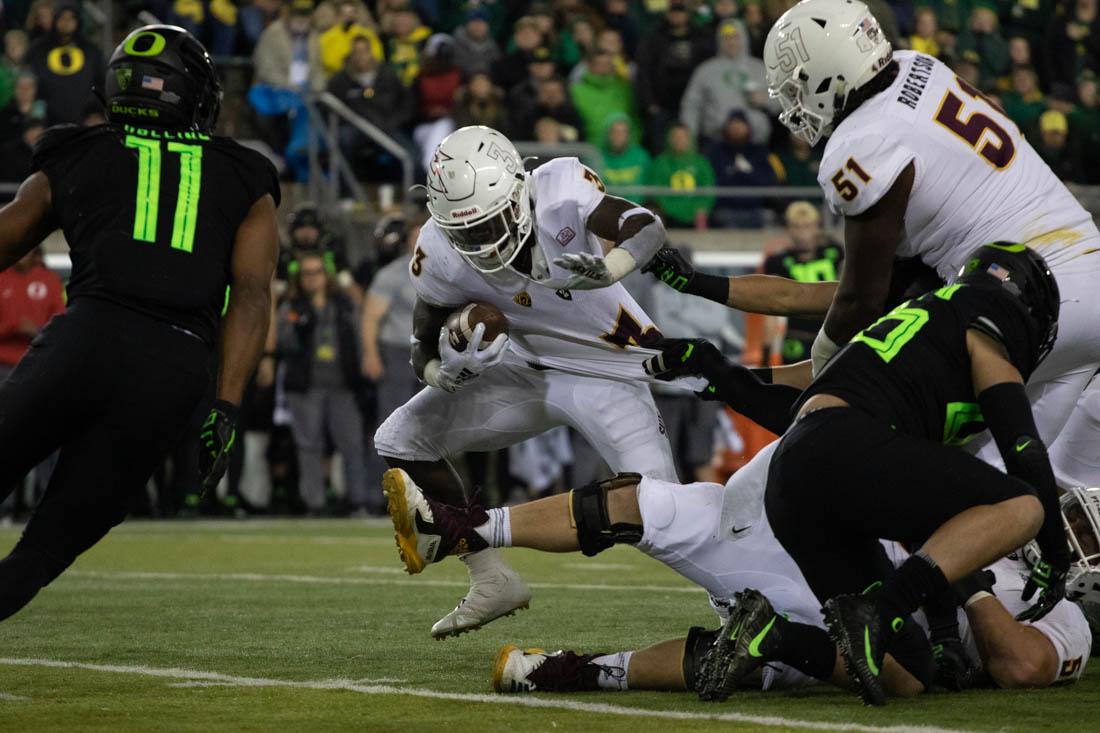 Oregon Ducks defense tackles Arizona State running back Eno Benjamin (3). Oregon Ducks football takes on Arizona State at Autzen Stadium in Eugene Ore. on Nov. 17, 2018. (Devin Roux/Emerald)