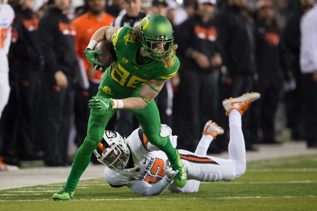 Oregon wide receiver Brenden Schooler (86) breaks the tackle of Oregon State Beavers cornerback Isaiah Dunn (22). The Oregon Ducks host the Oregon State Beavers for the 121st Civil War at Autzen Stadium in Eugene, Ore. on Saturday, Nov. 25, 2017. (Adam Eberhardt/Emerald)