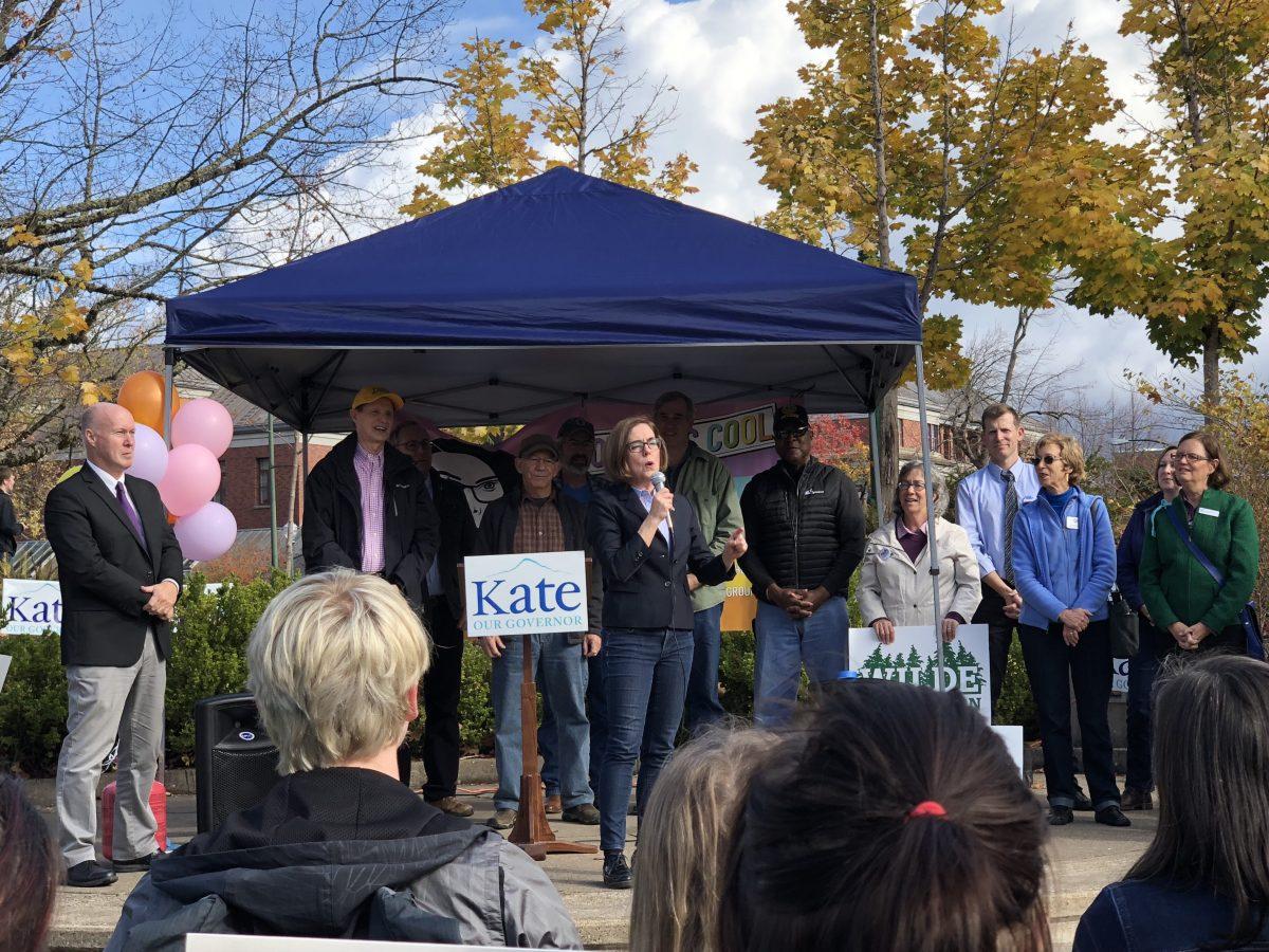 Governor Kate Brown speaks to a crowd assembled at the EMU Amphitheater Monday morning to encourage last-minute voting. (Becca Robbins/Emerald)