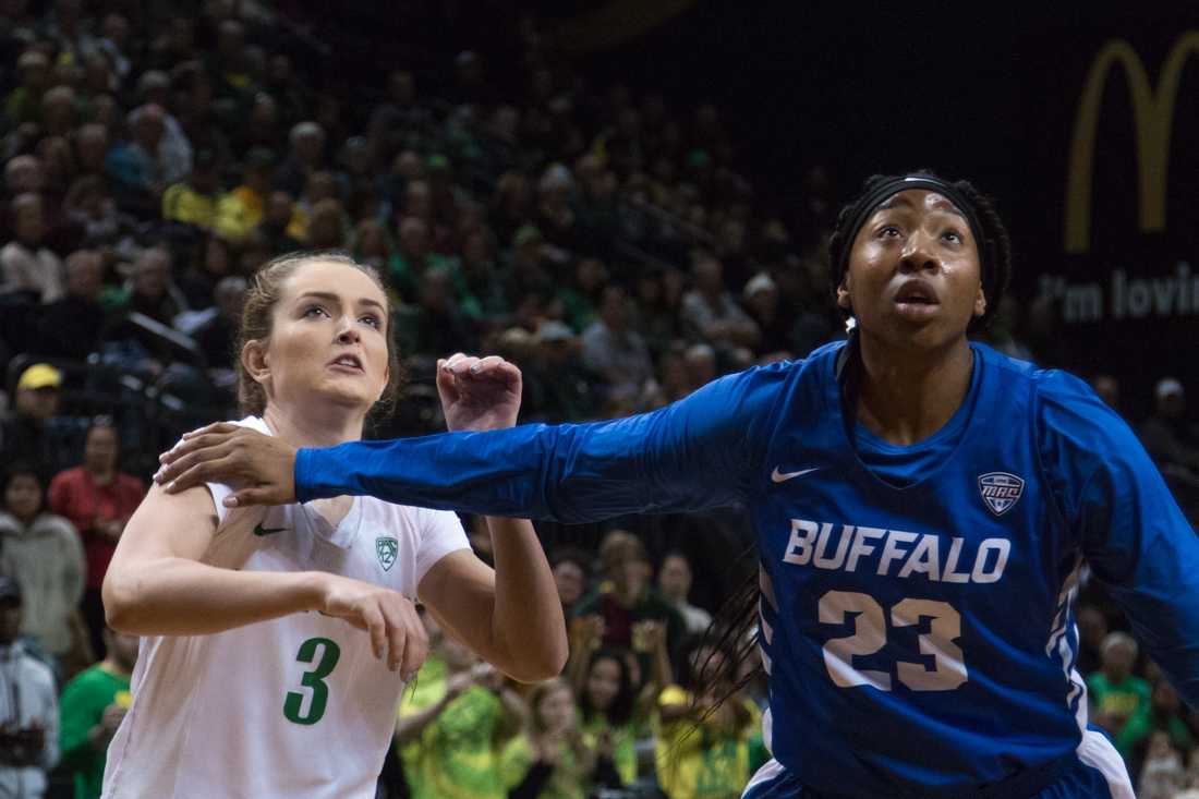 Bulls forawrd Keowa Walters (23) attempts to box out Ducks guard Taylor Chavez (3) during a free throw. Oregon Ducks women's basketball takes on the Buffalo Bulls at Matthew Knight Arena in Eugene Ore. on Nov. 18, 2018. (Ben Green/Emerald)