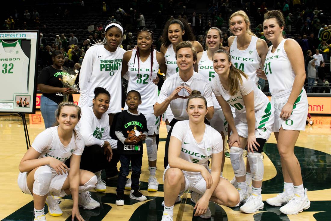 The Ducks women&#8217;s basketball team celebrate seniors Maite Cazorla (5) and Oti Gildon (32). Oregon Ducks women&#8217;s basketball defeat USC Trojans 96 to 78 while saying goodbye to seniors at Matthew Knight Arena in Eugene, Ore. Feb. 24, 2019. (Madi Mather/Emerald)