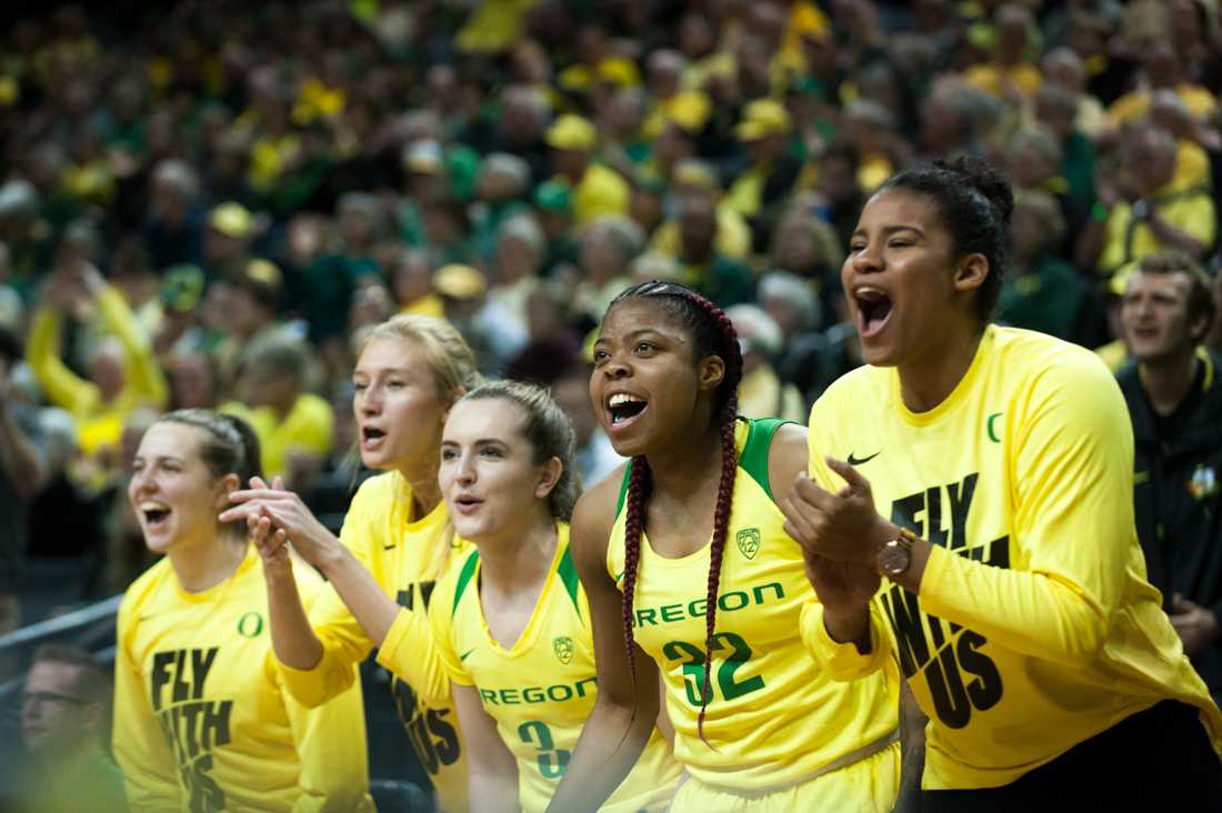 The Ducks bench celebrates after a three-point shot. Oregon Ducks women&#8217;s basketball takes on Oregon State University at Matthew Knight Arena in Eugene, Ore. on Feb. 15, 2019. (Ben Green/Emerald)