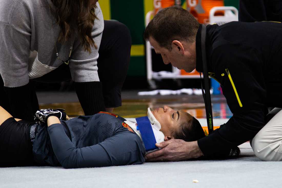 <p>Firestorm top Jayden Nelson (7) lays injured after a failed landing on the practice mat. Oregon Ducks acrobatics and tumbling meets with Arizona Christian University on Feb. 23, 2019. (Sarah Northrop/Emerald)</p>