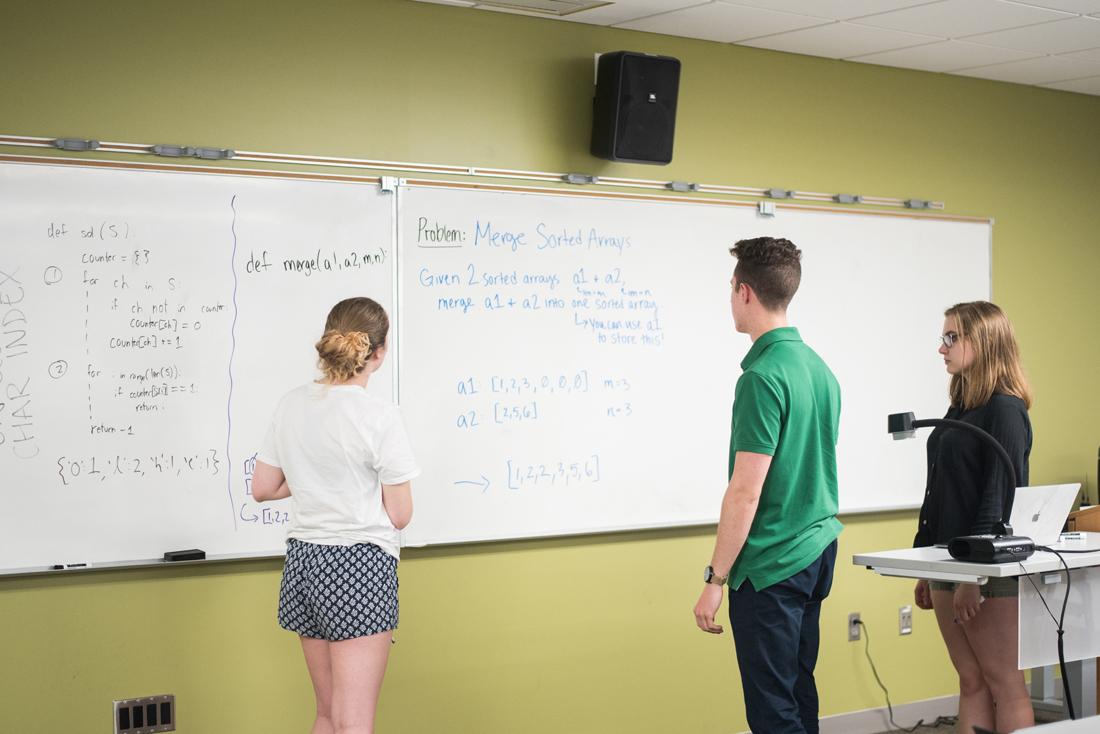 <p>Members of the Women in Computer Science student group work together to practice skills for technical interviews. (Marissa Willke/Emerald)</p>