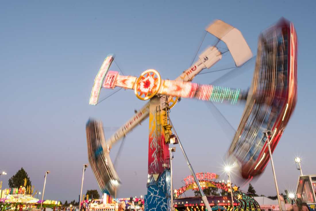 The &#8220;Kamikaze&#8221; sends riders in loops. The 2019 Lane County Fair transforms the Lane Events Center with rides, music and food on July 26, 2019. (Marissa Willke/Emerald)