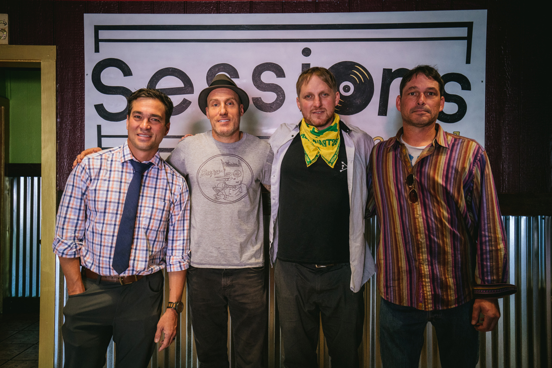 Nate Hisamura, Shane Cavanaugh, Danny Kime and Aaron Holmes stand in front of the new Sessions sign. (Dana Sparks/Emerald)