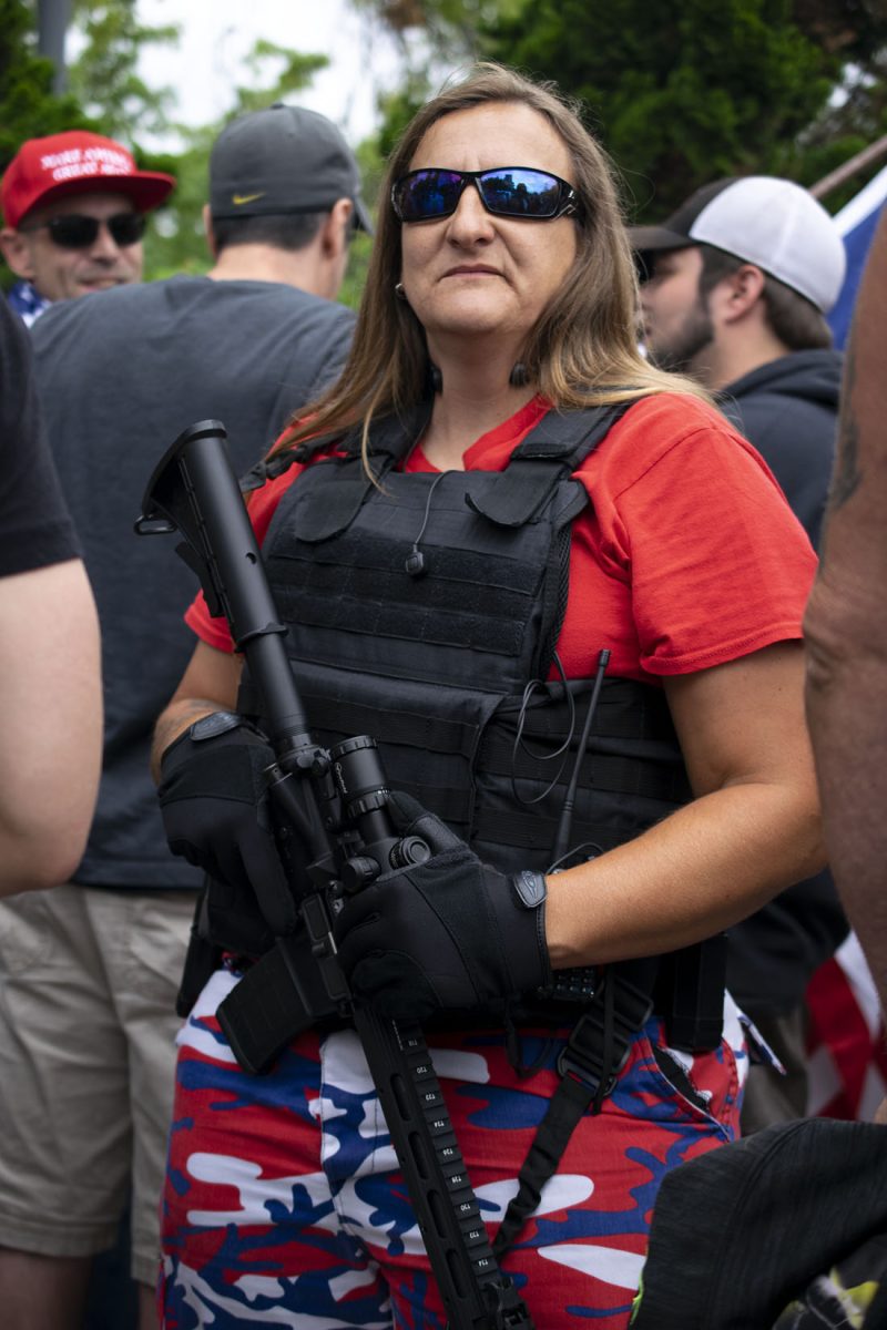 A rally attendee says she came to educate the public on how guns should be seen as a tool for protection. The God, Guns and Liberty rally gather at the Wayne Morse Free Speech Plaza on Aug. 10, 2019. (Kimberly Harris/Emerald)