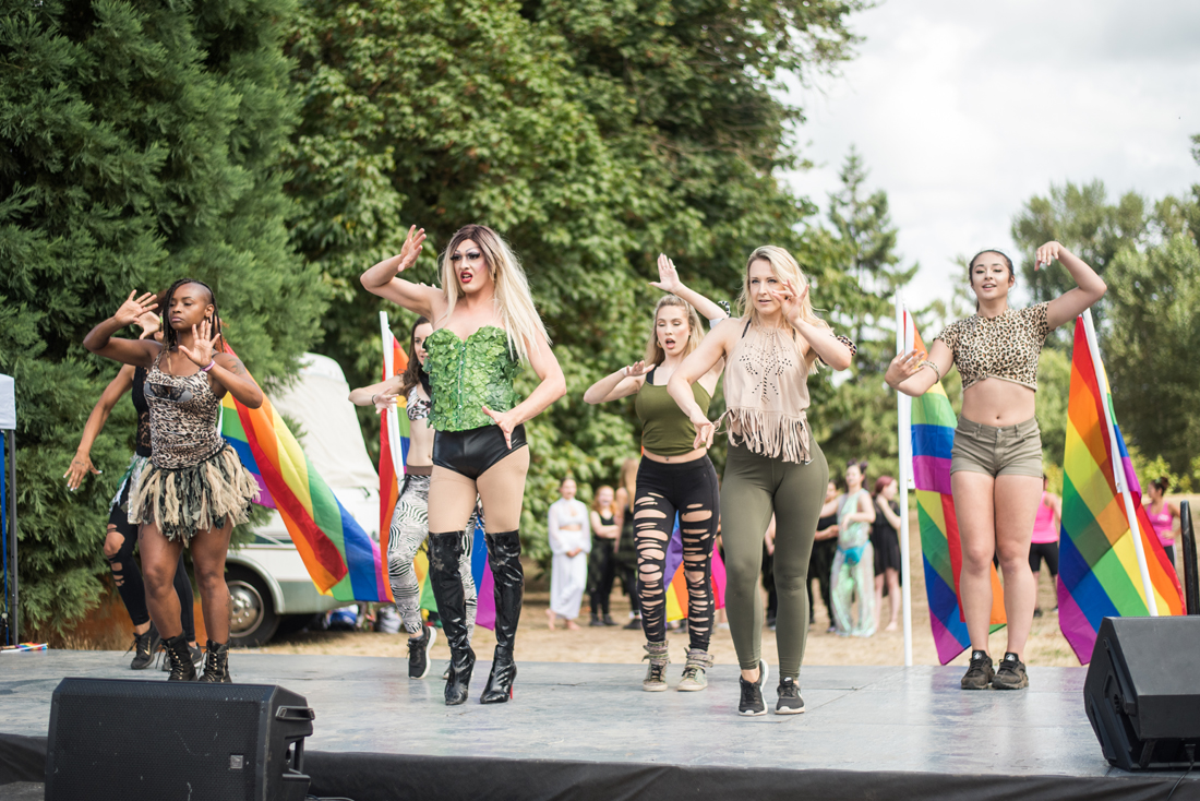 <p>A group of dancers take the stage at Eugene Pride in the Park, dancing to 