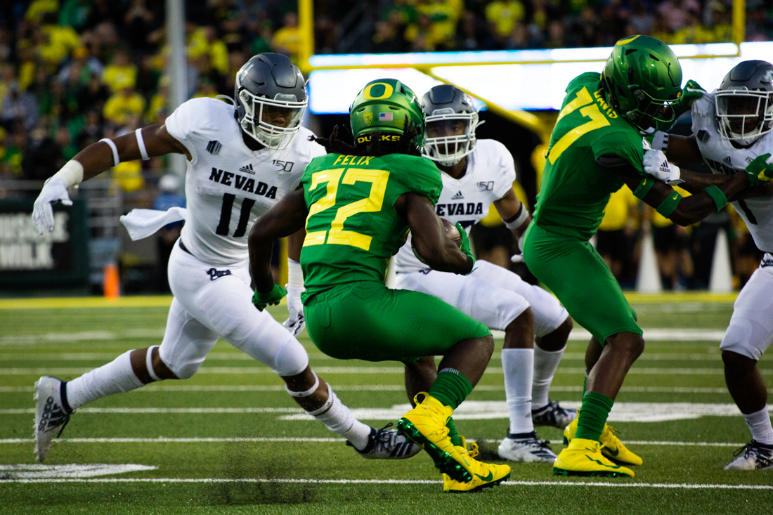 Ducks running back Darrian Felix (22) drives the ball down the field for a touchdown. Oregon Ducks football takes on the Nevada Wolf Pack at Autzen Stadium in Eugene, Ore. on Sept. 7, 2019. (Sarah Northrop/Emerald)