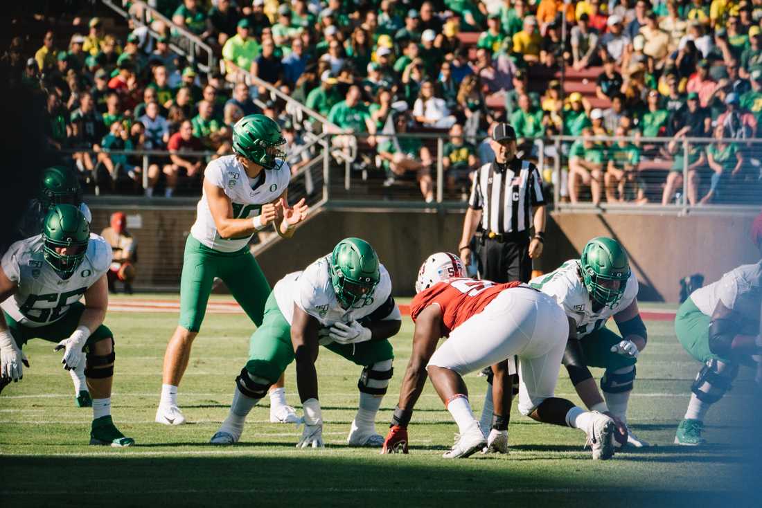 <p>The Ducks offense waits for quarterback Justin Herbert (10) to start the play. Oregon Ducks football takes on the Stanford Cardinal at Stanford Stadium in Stanford, Calif. on Sept. 21, 2019. (Connor Cox/Emerald)</p>