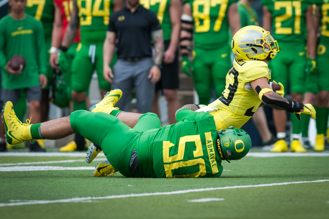 Defensive Lineman Pop Aumavae (50) sticks the tackle. Oregon Ducks football plays in the Spring game at Autzen Stadium in Eugene, Ore. on April 20, 2019. (Ben Green/Emerald)