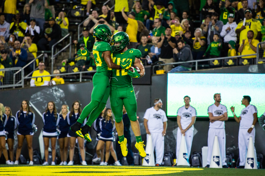 Ducks tight end Hunter Kampmoyer (48) celebrates the touchdown. Oregon Ducks football takes on the Nevada Wolf Pack at Autzen Stadium in Eugene, Ore. on Sept. 7, 2019. (Sarah Northrop/Emerald)