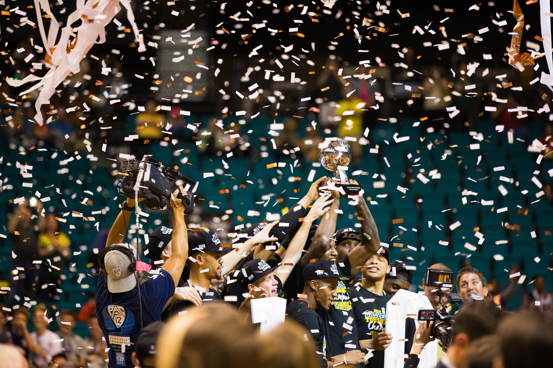 The Oregon Ducks celebrate their victory on stage. The Oregon Ducks face the Utah Utes in the Pac-12 Men&#8217;s Basketball Tournament at the MGM Grand Garden Arena in Las Vegas, Nev. on March 12, 2016. (Taylor Wilder/Emerald)