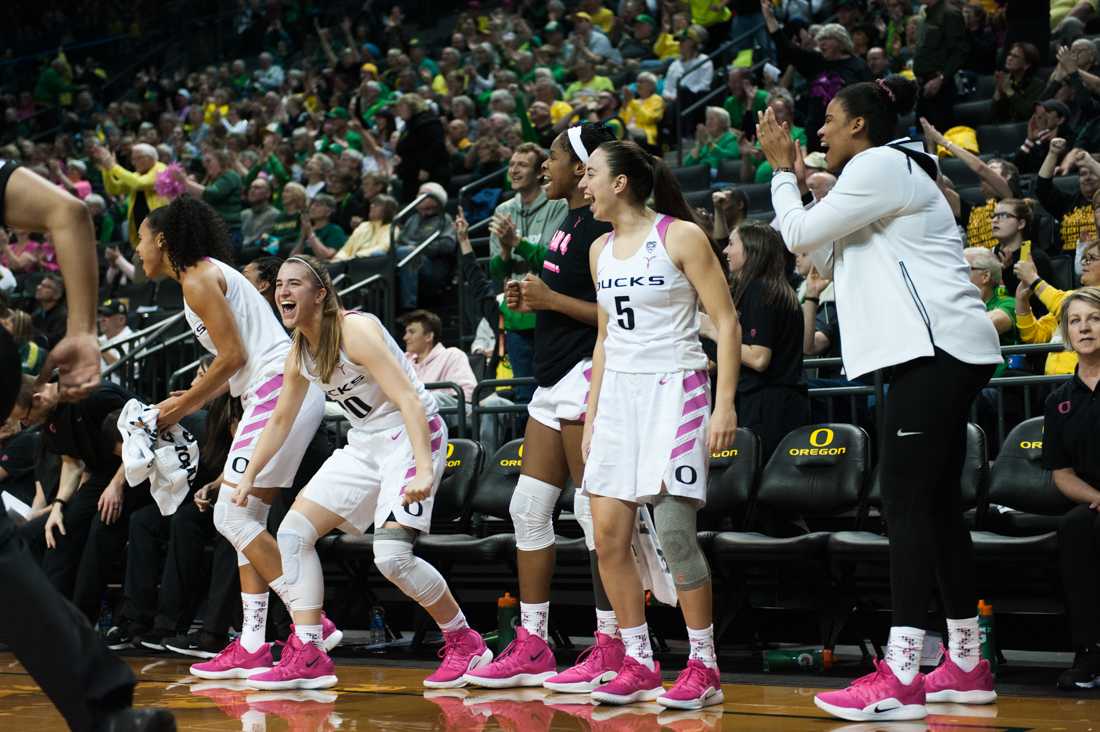 The Ducks bench celebrates a three-point shot. Oregon Ducks women&#8217;s basketball takes on University of Colorado Boulder at Matthew Knight Arena in Eugene, Ore. on Feb. 03, 2019. (Ben Green/Emerald)