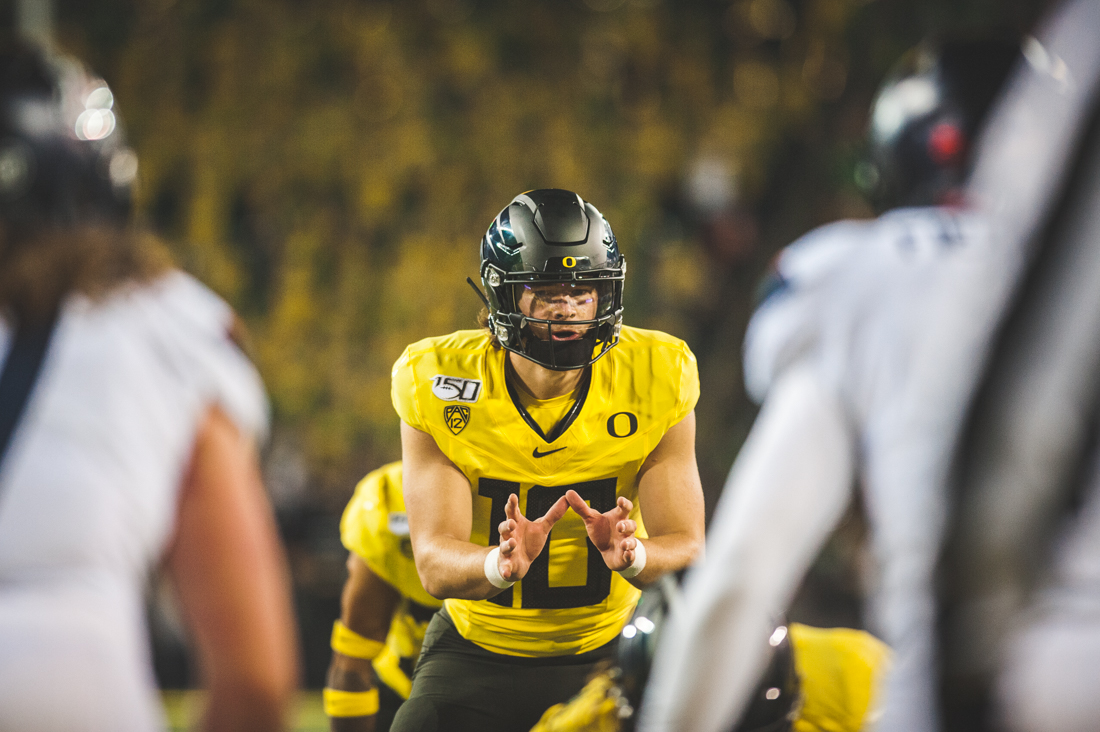 <p>Ducks quarterback Justin Herbert (10) sets up in the pistol pre snap. Oregon Ducks Football takes on the University of Arizona Wildcats at Autzen Stadium on Nov. 16, 2019. (DL Young/Emerald)</p>