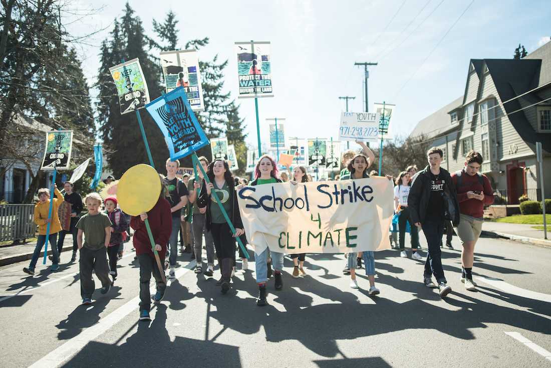 Demonstrators make their way down Hilyard St toward downtown. Eugene youth lead a climate strike march on March 15, 2019, ending in a protest at the Federal Courthouse. (Marissa Willke/Emerald)