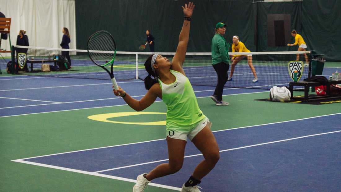 Rifanty Kahfiani serves for the Ducks in a doubles match. Oregon Ducks women's tennis takes on University of California at the Student Tennis Center in Eugene, Ore. on March 8, 2019. (Connor Cox/Emerald)