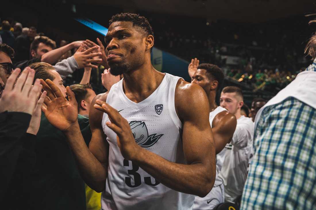 Duccks forward Francis Okoro (33) high fives the student section after the win. Oregon Ducks men's basketball takes on Arizona at Matthew Knight Arena in Eugene, Ore. on Jan. 9, 2020. (DL Young/Emerald