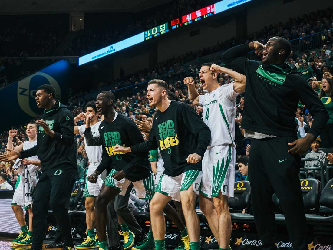 <p>The Ducks bench reacts to Francis Okoro's dunk. Oregon Ducks men’s basketball takes on University of Houston at Matthew Knight Arena in Eugene, Ore. on Nov. 22, 2019. (Connor Cox/Emerald)</p>