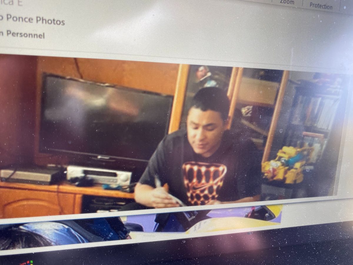 Eugene Police showed recent photos of Alejandro Ponce on a laptop at a press conference. (Courtesy of the Eugene Police Department)