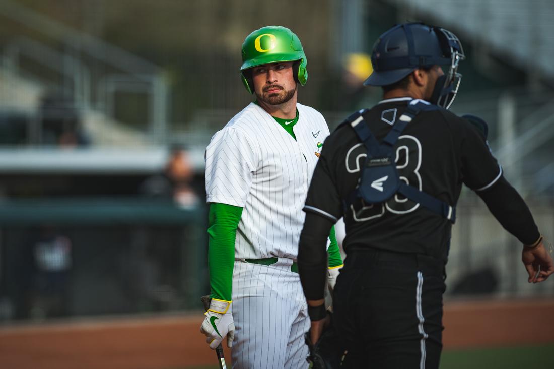 <p>Ducks designated hitter Kenyon Yovan (21) looks back at the umpire after a call. Oregon Ducks baseball takes on the Nevada Wolf Pack at PK Park in Eugene, Ore. on Feb. 22, 2020. (DL Young/ Emerald)</p>