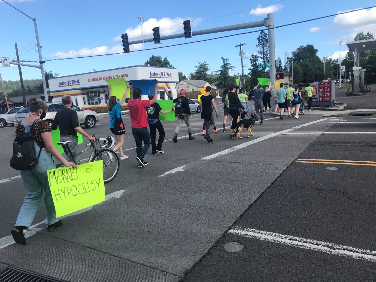 Protesters demonstrated outside of Market of Choice, calling into question the store's policy on displaying clothing supporting the Black Lives Matter movement (Duncan Baumgarten/Daily Emerald)