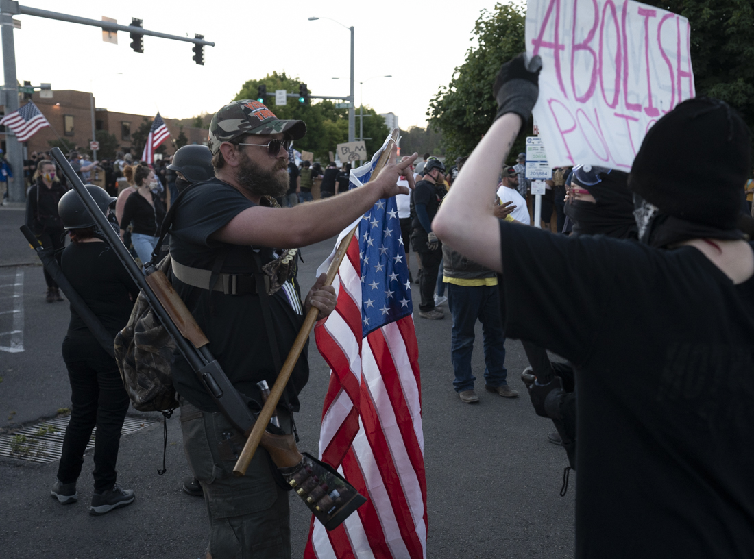 An All Lives Matter protester argues with an anti-racist protester. An All Lives Matter group protested against anti-racists outside the Federal Courthouse on Saturday, July 25th, at 8 p.m in Eugene, Ore. The confrontation turned violent after physical altercations. The standoff ended two hours later when anti-racists marched the All Lives Matter group away. (Kevin Wang/Daily Emerald)