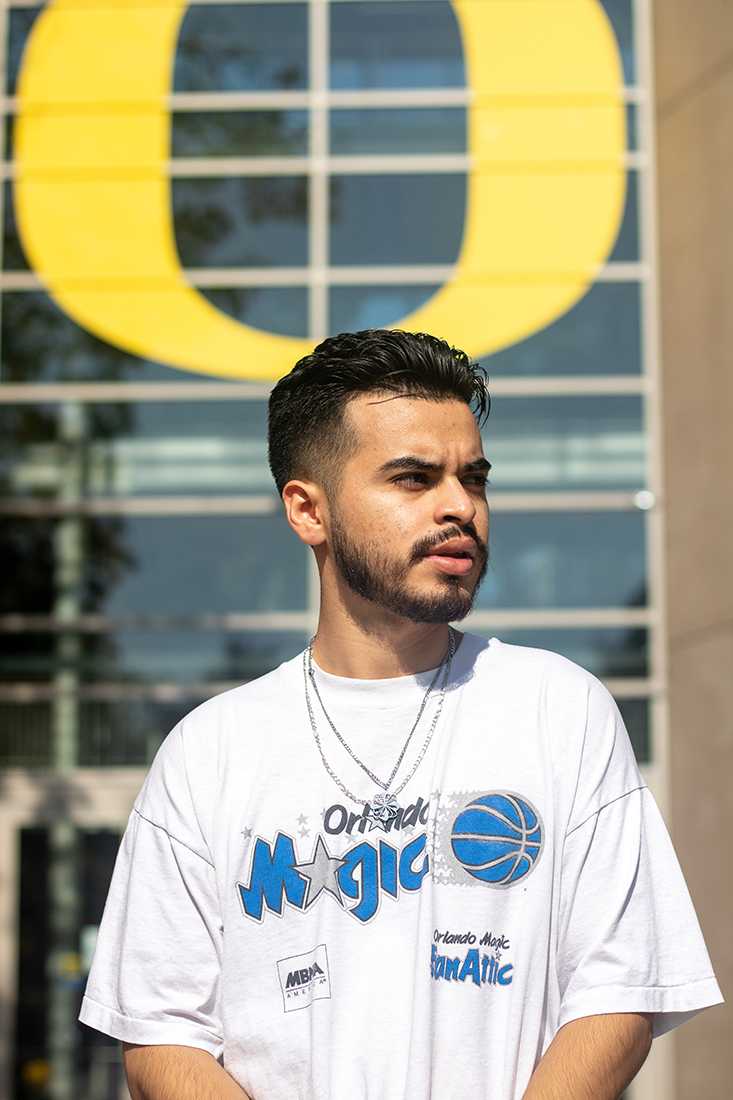 In addition to being a first-generation college student, Olivares also runs his own vintage apparel business, the Neighborhood Eugene Sustainability Team, or NEST. Eduardo Olivares is a first-generation college student and DACA recipient studying advertising at the University of Oregon. (Will Geschke/Emerald)