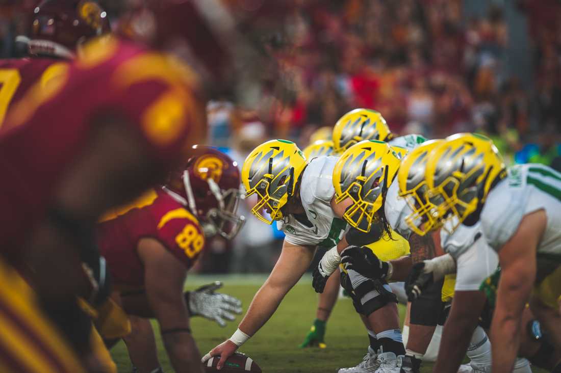 The oregon offensive line redies for a snap. Oregon Ducks Football takes on the Trojans at The Los Angeles Memorial Coliseum on Nov. 2, 2019. (DL Young/Emerald)