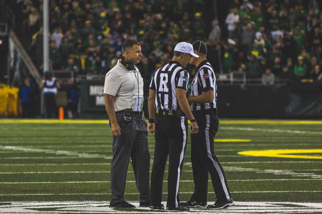 Ducks head coach Mario Cristobal talks to the referees. Oregon Ducks Football takes on University of California at Autzen Stadium in Eugene, Ore. on Oct. 5, 2019. (DL Young/Emerald)