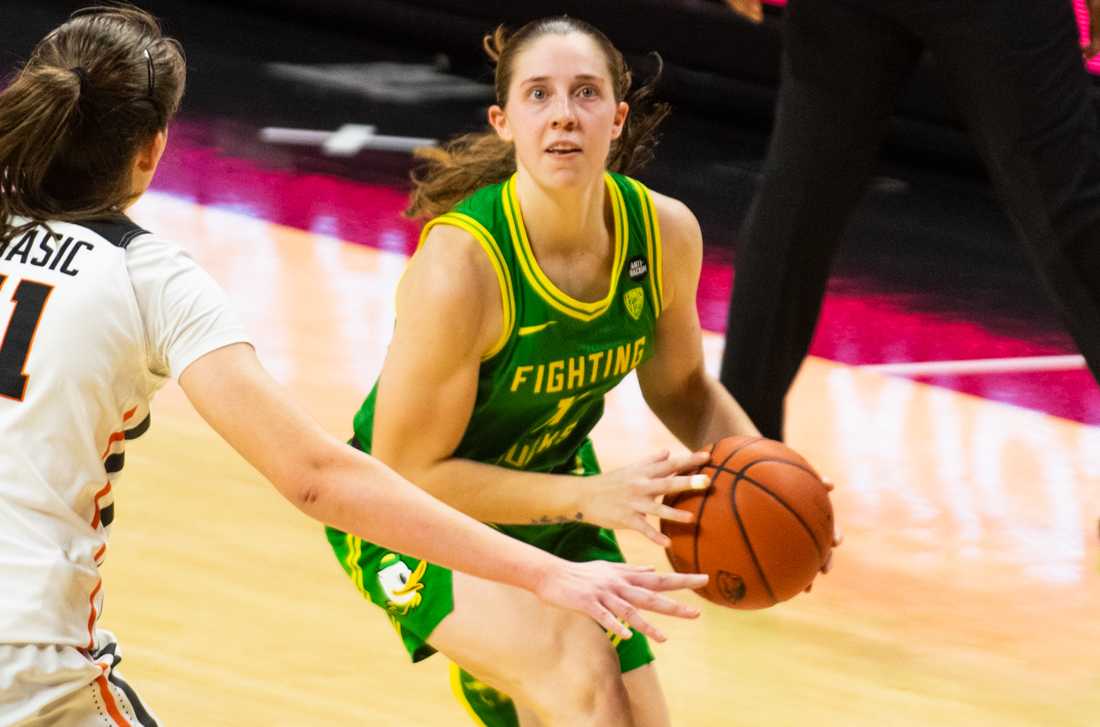 Ducks guard Taylor Mikesell (11) attempts a shot. Oregon Ducks take on the Oregon State Beavers at Gill Coliseum in Corvallis, Ore., on Dec. 13, 2020. (Kimberly Harris/Emerald)