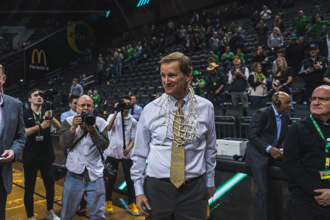 Ducks Head Coacch Dana Altman has the net draped around his neck after winning. Oregon Ducks men's basketball takes on Stanford at Matthew Knight Arena. on Mar. 7, 2020. (DL Young/Emerald)