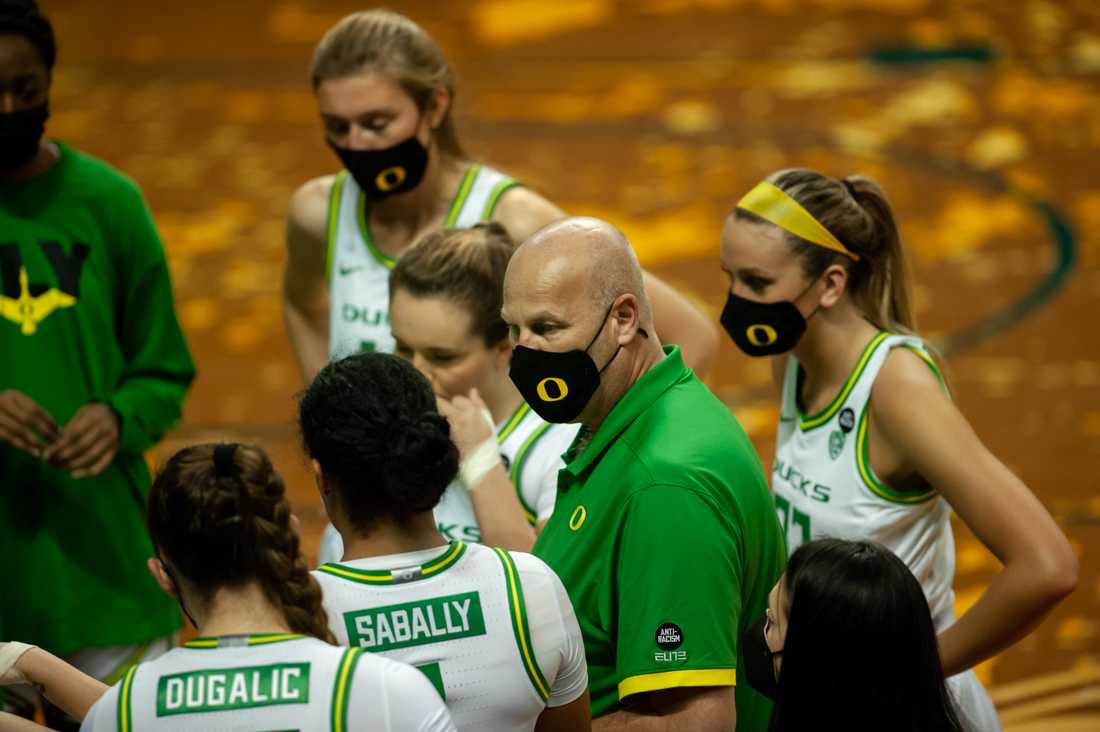 Ducks head coach Kelly Graves talks to teammates during a timeout. Oregon Ducks women&#8217;s basketball take on Oregon State Beavers at the Matthew Knight Arena in Eugene, Ore., on Feb. 28, 2021. (Maddie Knight/Emerald)