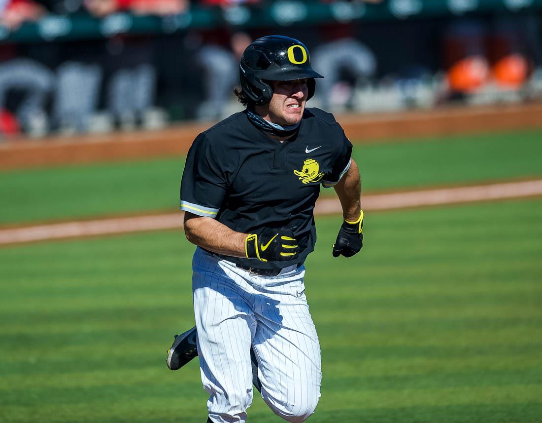 Ducks infielder Sam Novitske charges toward first base. Oregon Ducks baseball takes on the Seattle University RedHawks at PK Park in Eugene, Ore., on Feb. 28, 2021. (Ian Enger/Emerald)