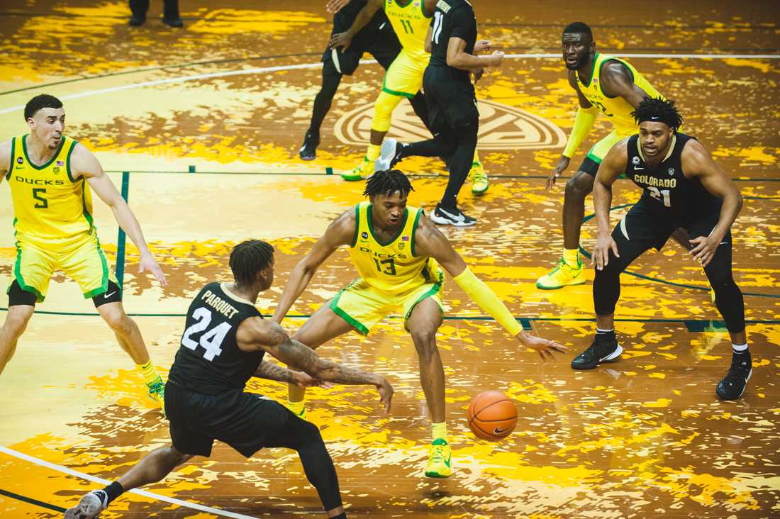 Ducks forward Chandler Lawson (13) looks to defend a pass. Ducks Men's Basketball takes on University of Colorado at Matthew Knight Stadium in Eugene, Ore., on Feb. 18, 2021. (DL Young/Emerald)