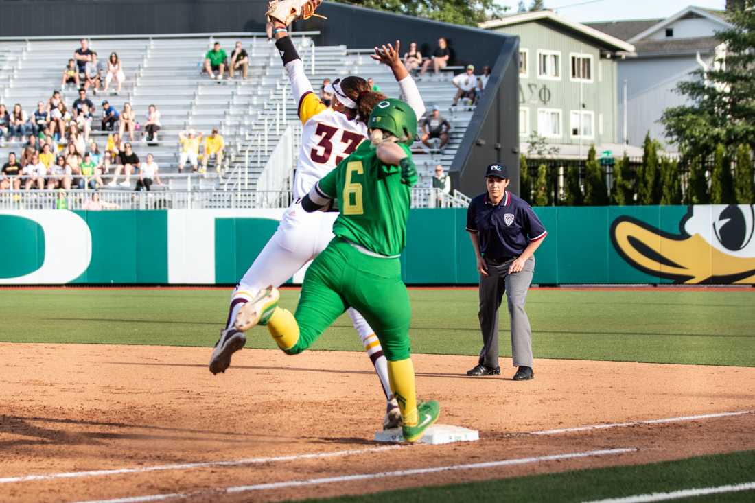 <p>Ducks first base April Utecht (6) makes an effort to advance to first base. Oregon softball takes on Arizona State at Jane Sanders Stadium in Eugene, Ore. on May 23, 2019. (Maddie Knight/Emerald)</p>