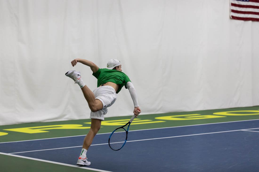 Ducks sophomore Jesper Kl&#246;v-Nilsson swings through his serve. Oregon Ducks men's tennis take on Portland State Vikings at the Student Tennis Center on Feb. 06, 2021. (Maddie Stellingwerf/Emerald)