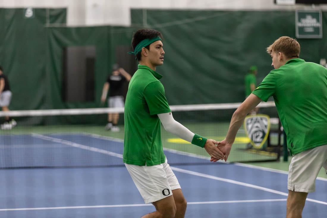 Ducks duo's Brandon Lam and Joshua Charlton celebrate after scoring. Oregon Ducks men's tennis take on Portland State Vikings at the Student Tennis Center on Feb. 06, 2021. (Maddie Stellingwerf/Emerald)