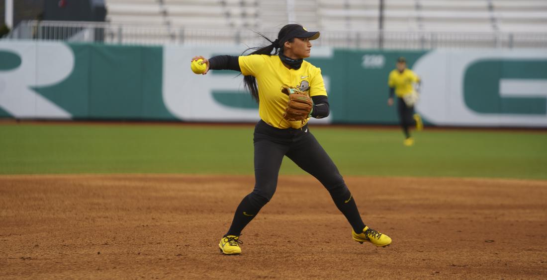 Ducks infielder Rachel Cid (20) winds up to throw the ball. Oregon softball takes on Boise State University at Jane Sanders Stadium in Eugene, Ore. on March 06, 2021. (Kevin Wang/Daily Emerald)