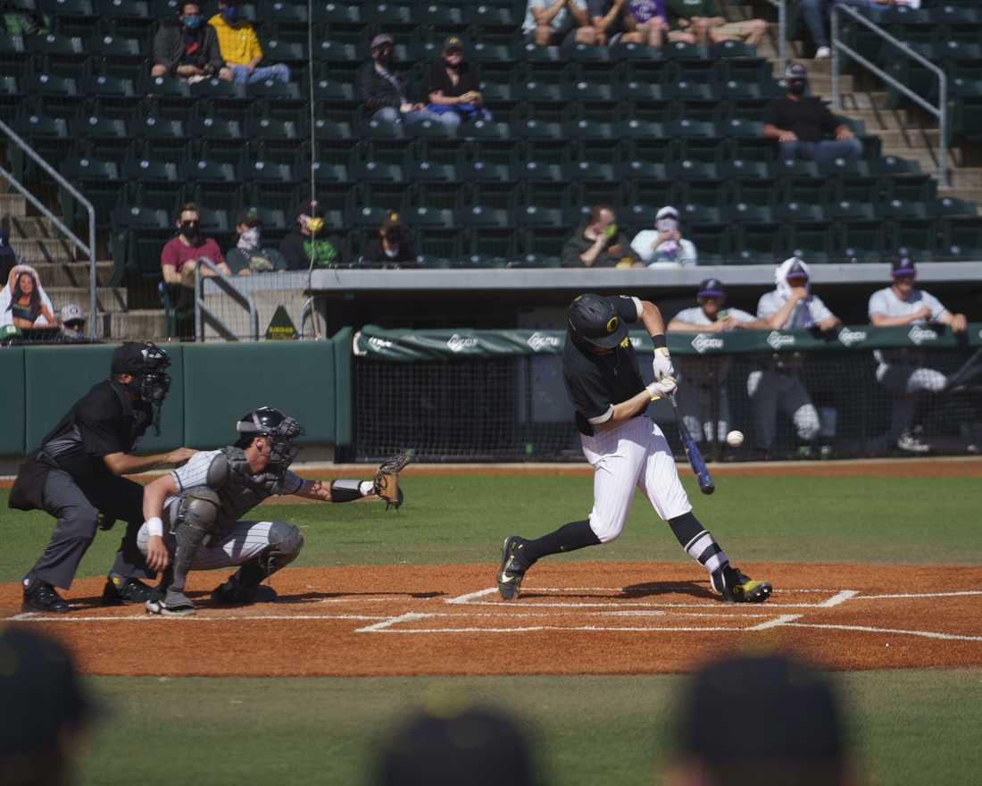 Ducks right handed pitcher/infielder Kenyon Yovan (21) swings at a pitch. Oregon Ducks baseball takes on Portland Pilots at PK Park in Eugene, Ore., on April 6, 2021. (Kevin Wang/Daily Emerald)