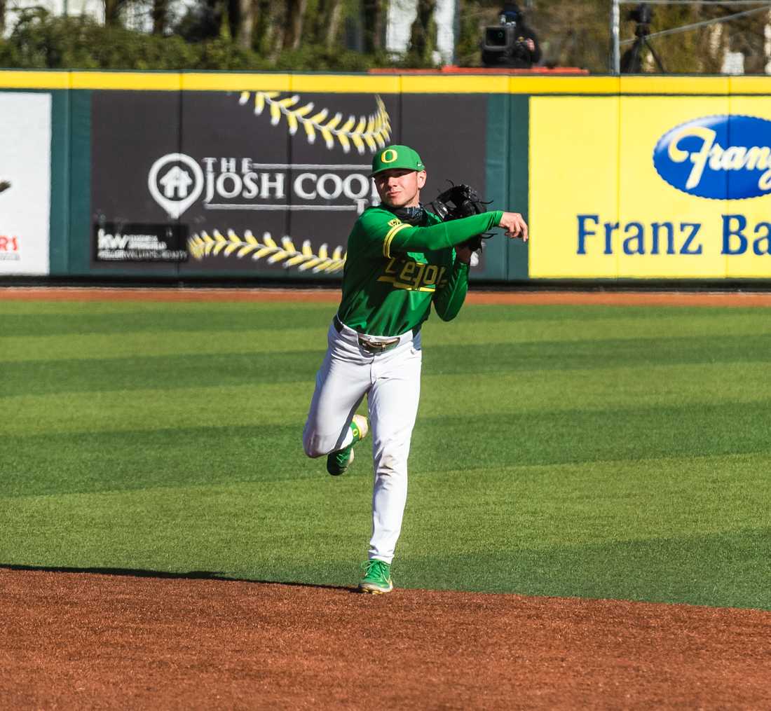 Oregon Ducks infielder Gavin Grant (5) throws the ball to his teammate. Oregon Ducks baseball takes on the Oregon State Beavers at PK Park in Eugene, Ore., on April 11, 2021. (Ian Enger/Emerald)