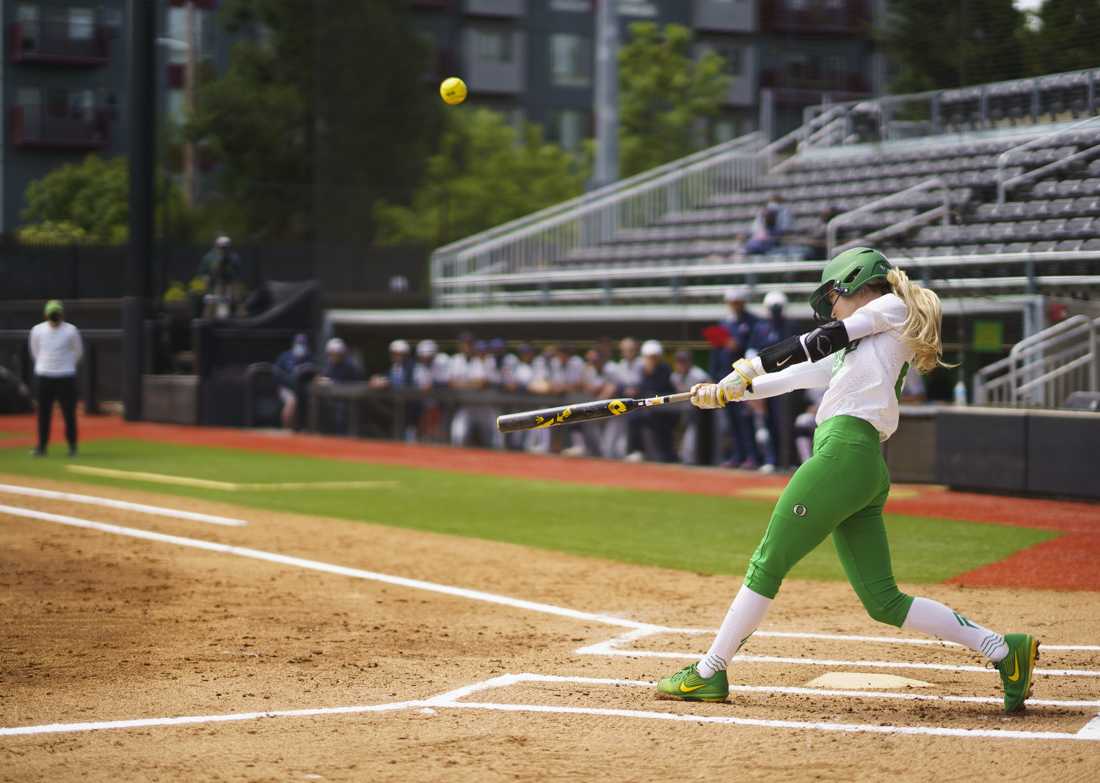 Ducks outfielder Haley Cruse (26) swings and hits a Arizona pitch. Oregon softball takes on Arizona Wildcats for senior day at Jane Sanders Stadium in Eugene, Ore. on May 09, 2021. (Kevin Wang/Daily Emerald)