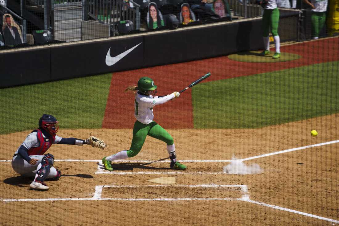 Ducks utility Allee Bunker (51) hits a Wildcat&#8217;s pitch. Oregon softball takes on Arizona Wildcats for senior day at Jane Sanders Stadium in Eugene, Ore. on May 09, 2021. (Kevin Wang/Daily Emerald)