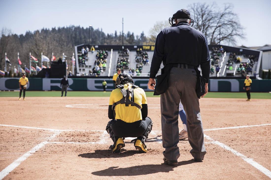 Ducks catcher Terra McGowan (11) awaits a pitch from Ducks Pitcher Brooke Yanez (23). Oregon Ducks Softball take on UCLA Bruins at Jane Sanders Stadium in Eugene, Ore., on April 11, 2021. (Maddie Stellingwerf/Emerald)